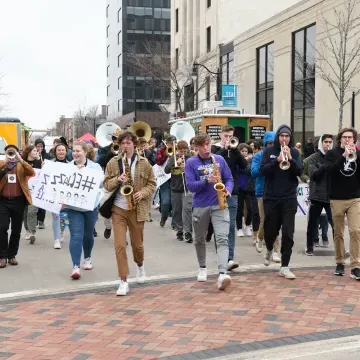 Group of musicians playing instrument for the Jazz Festival throughout downtown Eau Claire